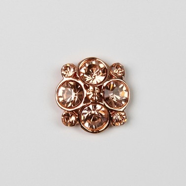 Rose gold and rhinestone button