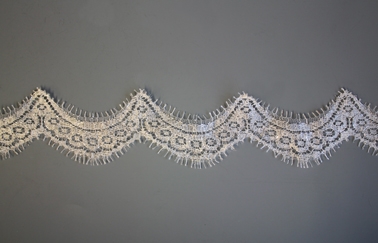 Neat ivory and silver scalloped lace with eyelash fringe